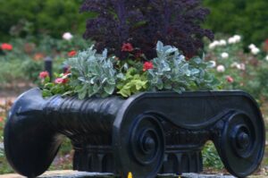 Two planters in the Rose Garden were crafted from iron column tops which were salvaged from the Bank of the State of Alabama. The downtown Mobile building, built in 1832, was demolished in 1930.