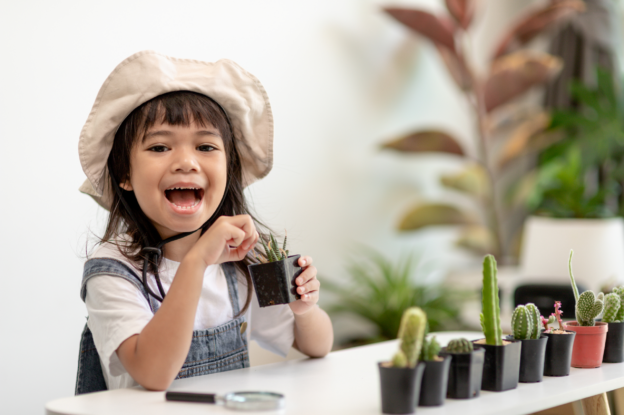 little girl with cacti