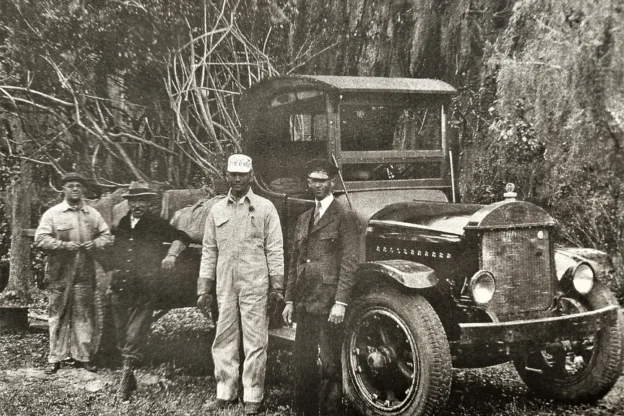 old photo of men with truck